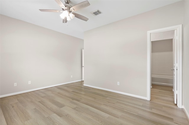 8315 Greys Ln, Houston, TX 77095 - spare room featuring ceiling fan, light wood finished floors, and baseboards