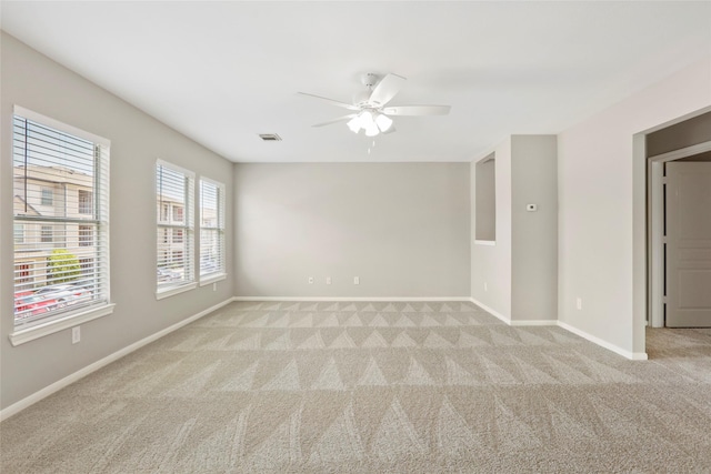 8315 Greys Ln, Houston, TX 77095 - spare room with light colored carpet, ceiling fan, and baseboards
