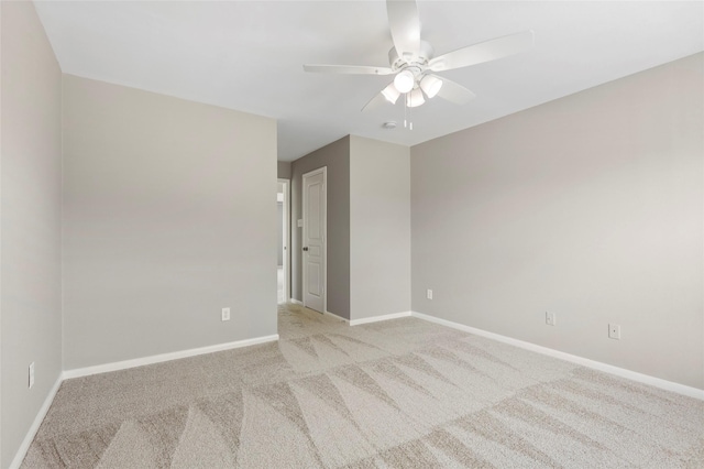 8315 Greys Ln, Houston, TX 77095 - empty room featuring a ceiling fan, light carpet, and baseboards