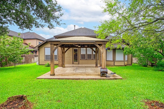 20702 Elderwood Terrace Dr, Richmond, TX 77406 - rear view of house featuring a gazebo, a shingled roof, and a patio