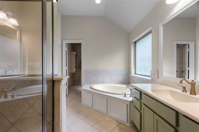 20702 Elderwood Terrace Dr, Richmond, TX 77406 - bathroom featuring tile patterned floors, vaulted ceiling, a bath, vanity, and a shower stall