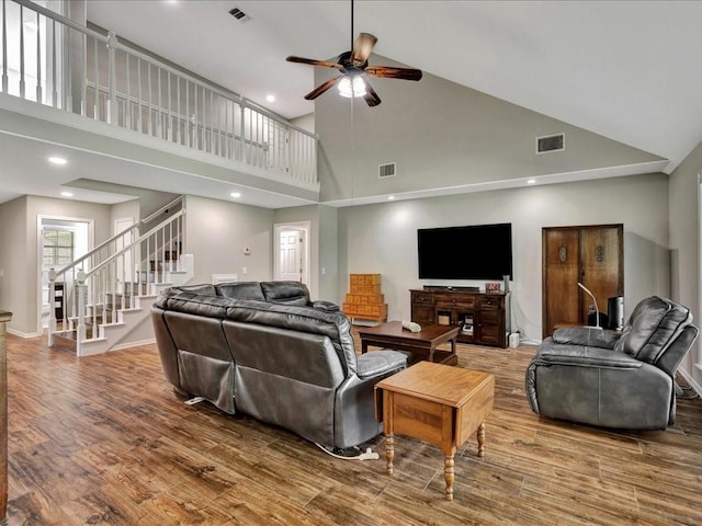 238 Royal Pnes, Lufkin, TX 75904 - living area featuring high vaulted ceiling, stairway, a ceiling fan, wood finished floors, and baseboards