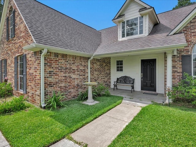 238 Royal Pnes, Lufkin, TX 75904 - view of front facade with roof with shingles, brick siding, and a front lawn
