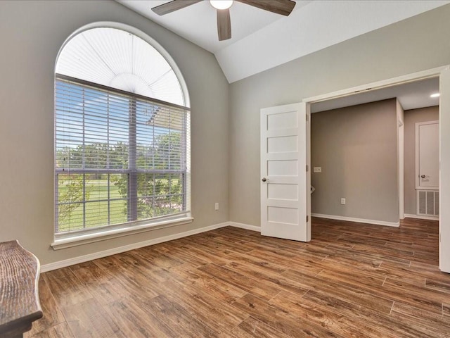 238 Royal Pnes, Lufkin, TX 75904 - empty room featuring healthy amount of natural light, a ceiling fan, wood finished floors, baseboards, and vaulted ceiling
