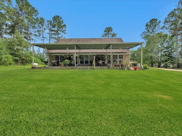 238 Royal Pnes, Lufkin, TX 75904 - back of property featuring a lawn