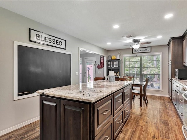 238 Royal Pnes, Lufkin, TX 75904 - kitchen featuring baseboards, dark brown cabinets, wood finished floors, recessed lighting, and ceiling fan