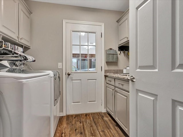 238 Royal Pnes, Lufkin, TX 75904 - washroom featuring cabinet space, washing machine and clothes dryer, and dark wood-type flooring