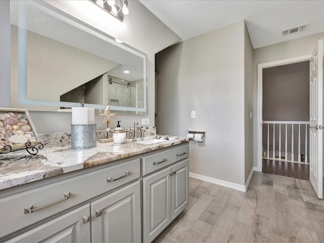 238 Royal Pnes, Lufkin, TX 75904 - full bath featuring wood finished floors, vanity, baseboards, and a shower stall