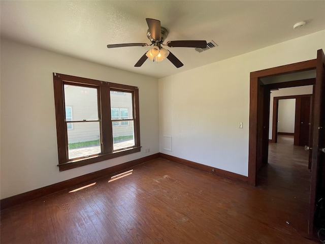 611 Fahrenthold St, El Campo, TX 77437 - empty room featuring baseboards, wood finished floors, and a ceiling fan