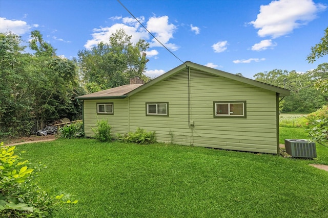 11104 Quinlan N Lake Dr, Conroe, TX 77303 - view of side of property with a yard and a chimney