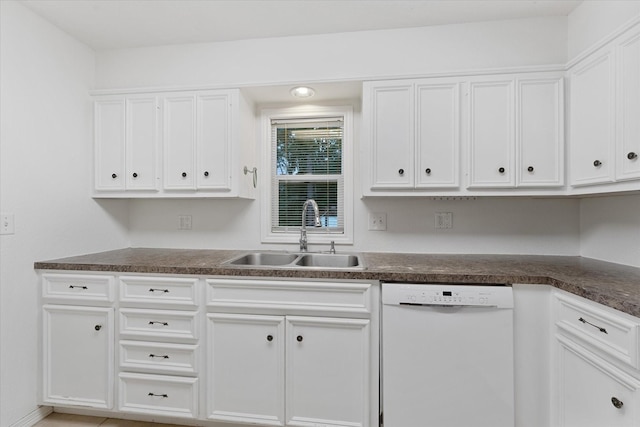 11104 Quinlan N Lake Dr, Conroe, TX 77303 - kitchen featuring dishwasher, dark countertops, and white cabinetry