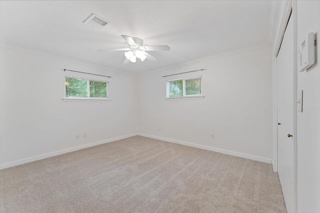 11104 Quinlan N Lake Dr, Conroe, TX 77303 - spare room featuring healthy amount of natural light, crown molding, light carpet, and ceiling fan