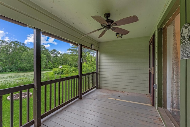 11104 Quinlan N Lake Dr, Conroe, TX 77303 - wooden terrace featuring ceiling fan and a lawn