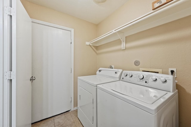 526 Trail Springs Ct, Kingwood, TX 77339 - washroom featuring independent washer and dryer and light tile patterned floors