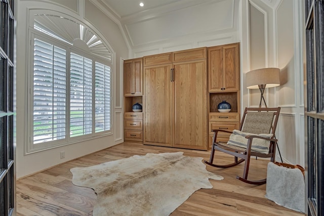131 Sarasota Cir S, Montgomery, TX 77356 - living area featuring light wood-style floors and crown molding