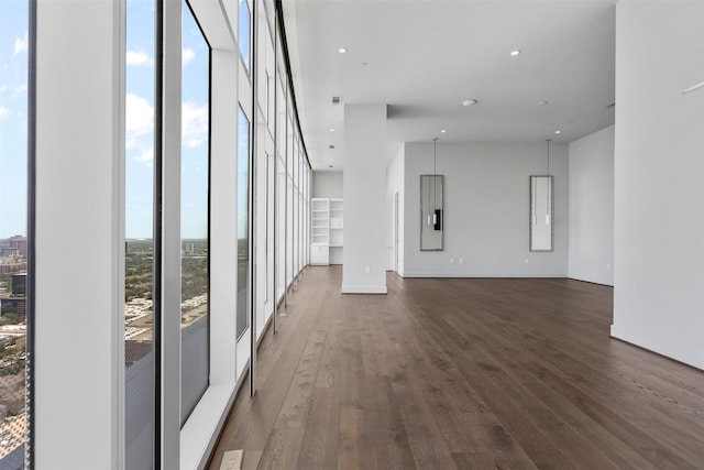 4521 San Felipe St Unit 3101, Houston, TX 77027 - unfurnished living room featuring dark wood finished floors and recessed lighting