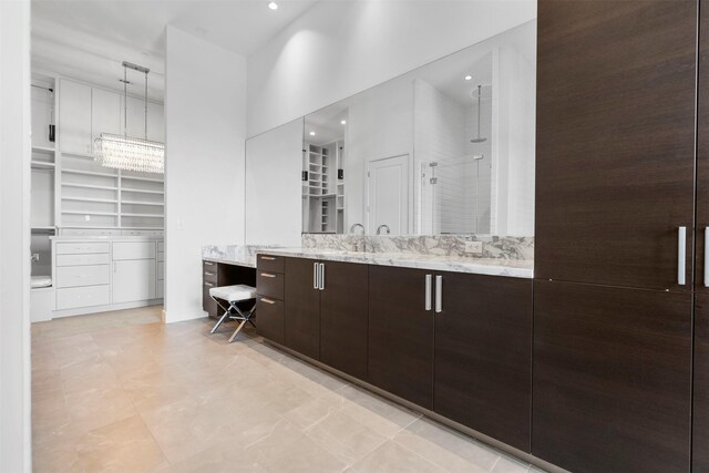 4521 San Felipe St Unit 3101, Houston, TX 77027 - bathroom featuring a stall shower, vanity, and a walk in closet