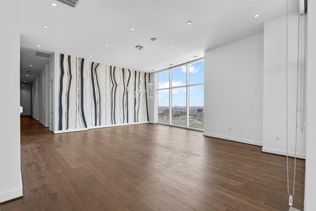 4521 San Felipe St Unit 3101, Houston, TX 77027 - unfurnished living room featuring hardwood / wood-style floors, expansive windows, and recessed lighting