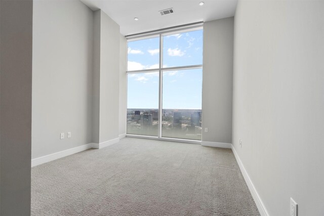 4521 San Felipe St Unit 3101, Houston, TX 77027 - carpeted empty room with floor to ceiling windows and baseboards