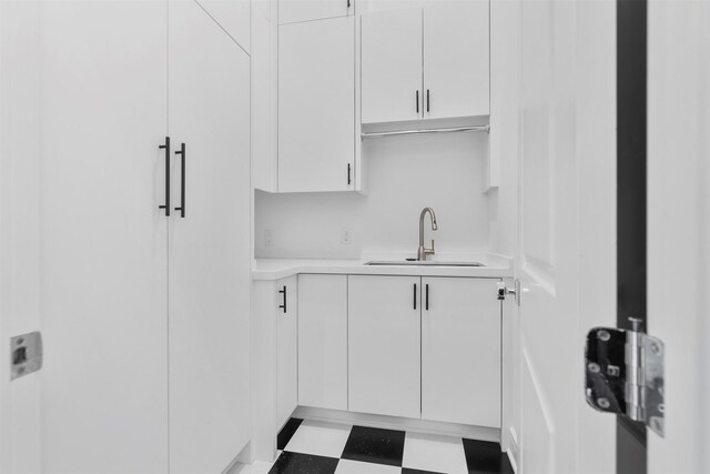 4521 San Felipe St Unit 3101, Houston, TX 77027 - kitchen with light countertops, tile patterned floors, and white cabinets