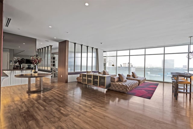 4521 San Felipe St Unit 3101, Houston, TX 77027 - living room featuring wood finished floors and a wall of windows