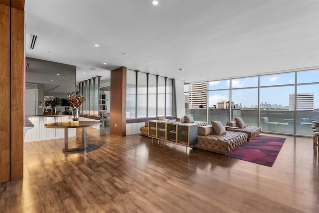 4521 San Felipe St Unit 3101, Houston, TX 77027 - living area featuring wood finished floors, healthy amount of natural light, expansive windows, and a view of city