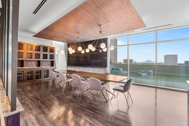 4521 San Felipe St Unit 3101, Houston, TX 77027 - dining room with a chandelier, expansive windows, wood finished floors, wood ceiling, and a view of city