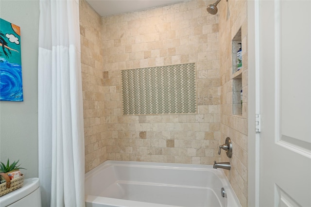 15661 Lakeway Dr Unit 19, Willis, TX 77318 - bathroom featuring shower / tub combo and toilet