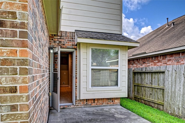 24430 Silverton Valley Ln, Katy, TX 77494 - entrance to property featuring brick siding, a shingled roof, and a patio