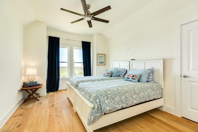 4003 Kiva Rd, Galveston, TX 77554 - bedroom featuring lofted ceiling, light wood-style floors, baseboards, and a ceiling fan