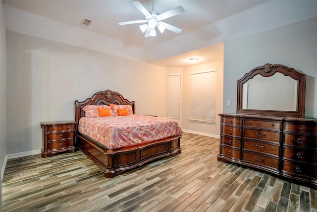 31007 Laurel Creek Ln, Conroe, TX 77385 - bedroom with wood finished floors, baseboards, and ceiling fan