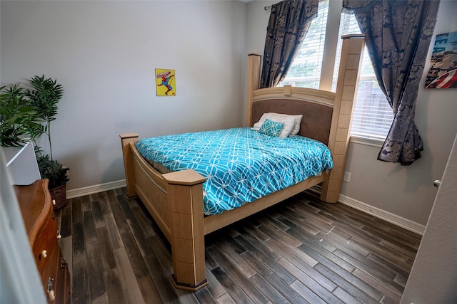 31007 Laurel Creek Ln, Conroe, TX 77385 - bedroom featuring dark wood-style flooring and baseboards