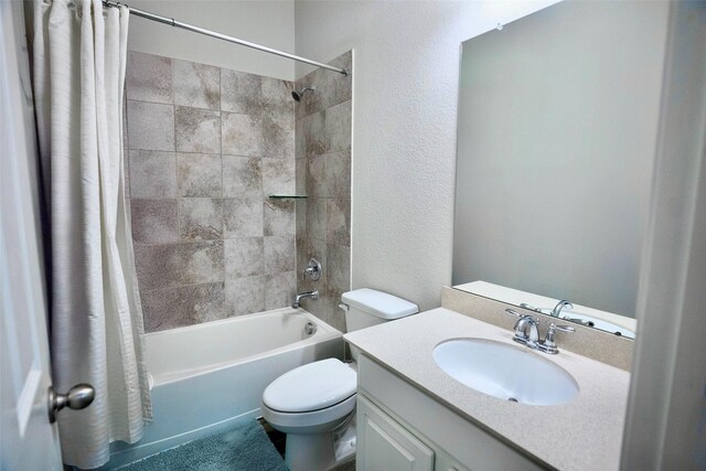 31007 Laurel Creek Ln, Conroe, TX 77385 - bathroom with shower / bath combo with shower curtain, toilet, vanity, and a textured wall