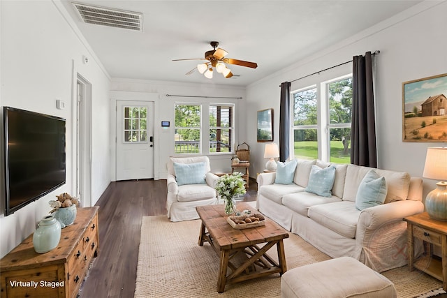 12602 24th St, Santa Fe, TX 77510 - living room featuring a ceiling fan, ornamental molding, and wood finished floors