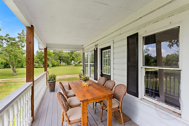 12602 24th St, Santa Fe, TX 77510 - porch featuring a lawn and outdoor dining space