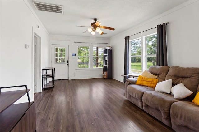 12602 24th St, Santa Fe, TX 77510 - living area featuring ceiling fan, dark wood finished floors, and crown molding