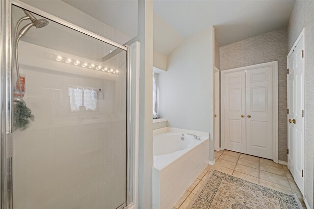 5325 High Bank Dr, Corpus Christi, TX 78413 - full bathroom featuring a bath, a stall shower, tile patterned flooring, a closet, and baseboards