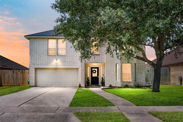 5325 High Bank Dr, Corpus Christi, TX 78413 - view of front facade featuring a garage, concrete driveway, and brick siding