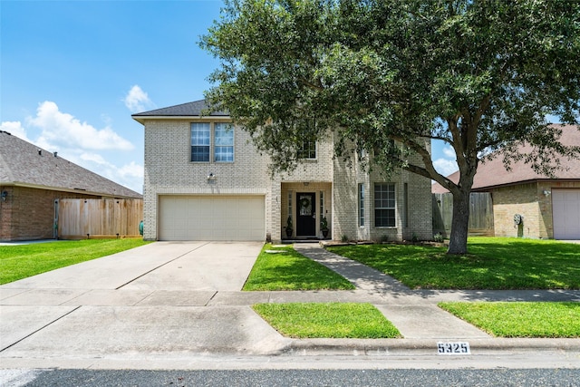 5325 High Bank Dr, Corpus Christi, TX 78413 - view of front of house with an attached garage, brick siding, and driveway