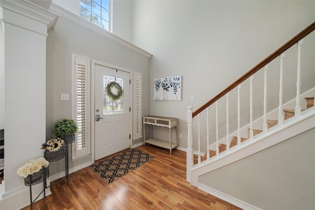 5325 High Bank Dr, Corpus Christi, TX 78413 - entryway featuring healthy amount of natural light, stairway, a towering ceiling, and wood finished floors