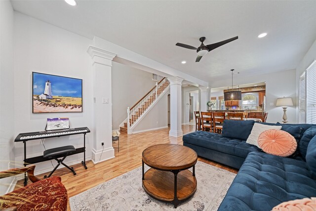 5325 High Bank Dr, Corpus Christi, TX 78413 - living area featuring ornate columns, wood finished floors, ceiling fan, recessed lighting, and stairway