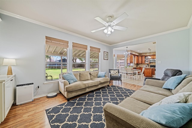 5325 High Bank Dr, Corpus Christi, TX 78413 - living area with ceiling fan, light wood-style floors, crown molding, baseboards, and a chandelier