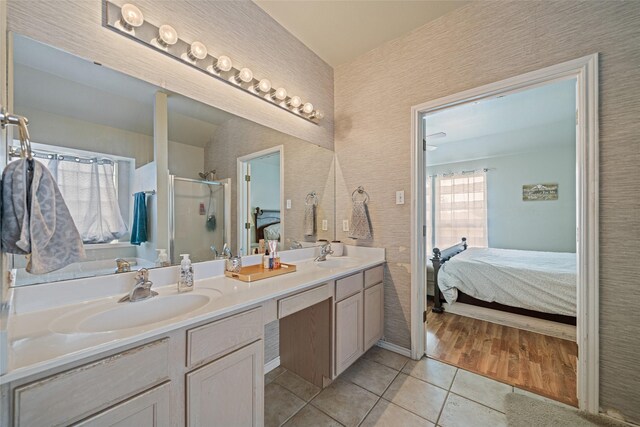 5325 High Bank Dr, Corpus Christi, TX 78413 - full bath featuring connected bathroom, tile patterned flooring, double vanity, and a shower stall