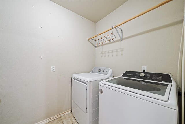 5325 High Bank Dr, Corpus Christi, TX 78413 - washroom with independent washer and dryer and baseboards