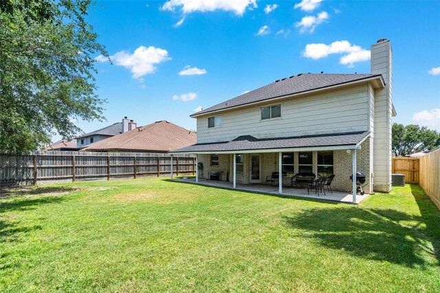 5325 High Bank Dr, Corpus Christi, TX 78413 - rear view of house with a chimney, cooling unit, a patio area, and brick siding