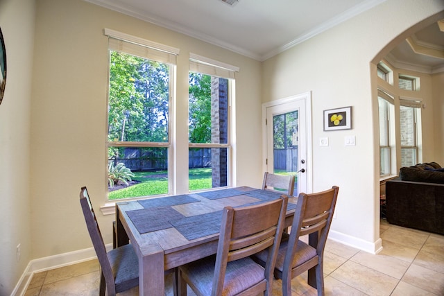 110 Deer Plain Dr, Spring, TX 77389 - dining area with arched walkways, ornamental molding, light tile patterned floors, and baseboards