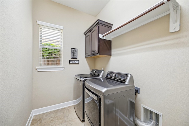 110 Deer Plain Dr, Spring, TX 77389 - laundry area with separate washer and dryer, cabinet space, baseboards, and light tile patterned floors
