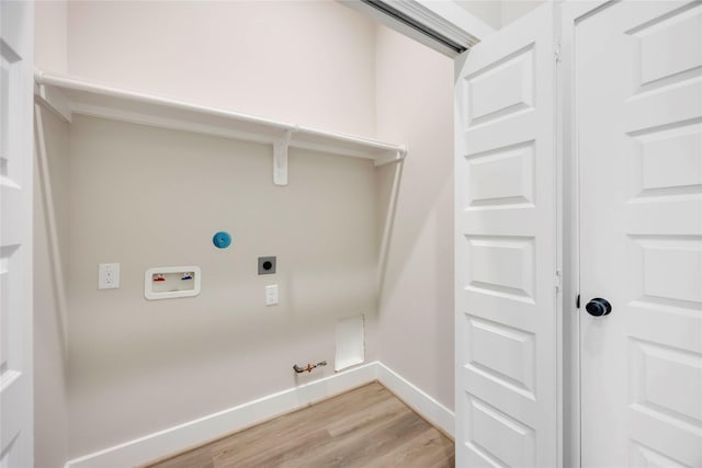 3711 Bain St, Houston, TX 77026 - washroom with hookup for a gas dryer, hookup for an electric dryer, light wood-style flooring, baseboards, and washer hookup