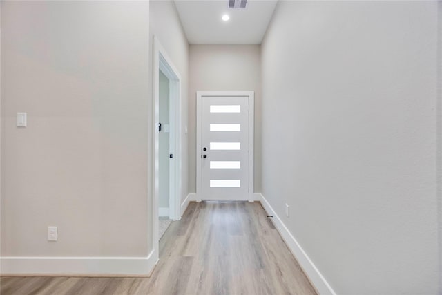 3711 Bain St, Houston, TX 77026 - entryway featuring light wood-style floors and baseboards