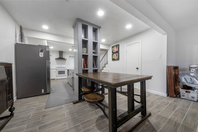 9501 Fondren Rd Unit 9, Houston, TX 77074 - dining room with stairs, wood tiled floors, recessed lighting, and baseboards